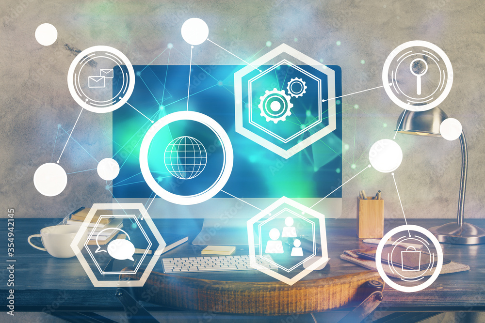 Computer on desktop with social network theme icon. Multi exposure. Concept of international connections. Computer on desktop with social network theme icon. Multi exposure. Concept of international connections.