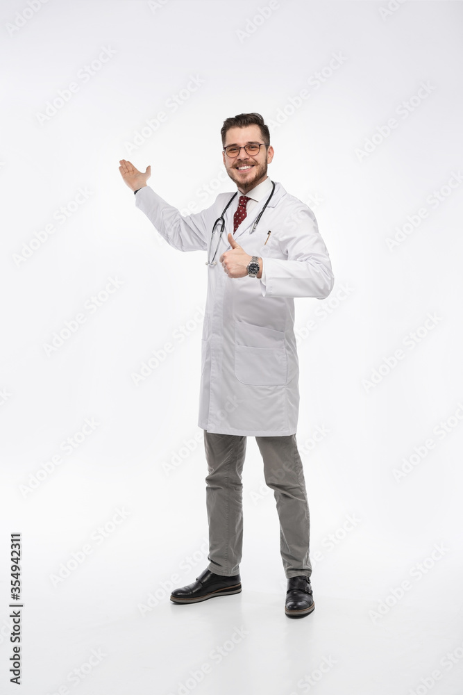 A portrait of a medical doctor posing against white background A portrait of a medical doctor posing against white background