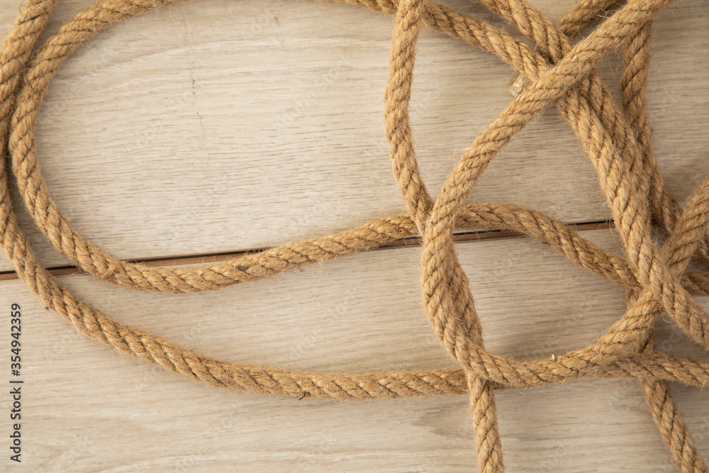 old rope on the wooden background