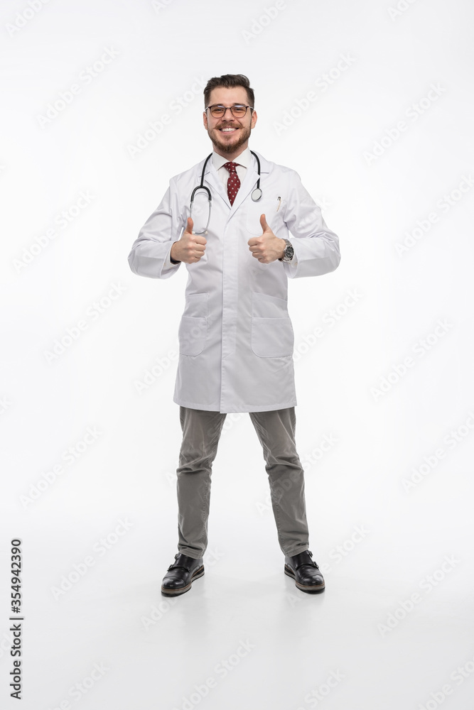 A portrait of a medical doctor posing against white background A portrait of a medical doctor posing against white background