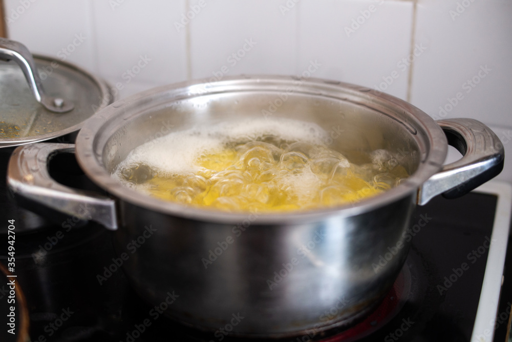 pot of boiling water on the stove large pot of boiling water on the stove large
