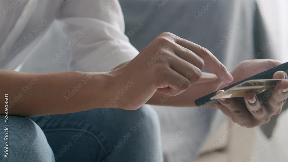 Hand of young women are buying online with credit card using smartphone Hand of young women are buying online with credit card using smartphone