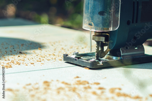 Electric jig saw for cutting plywood and wood