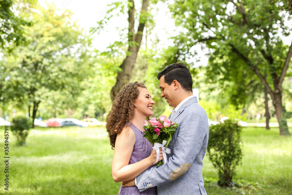 Bridal couple posing in the park