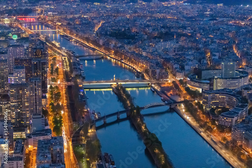 Panorama of Paris in the evening from the height of bird flight at sunset © max
