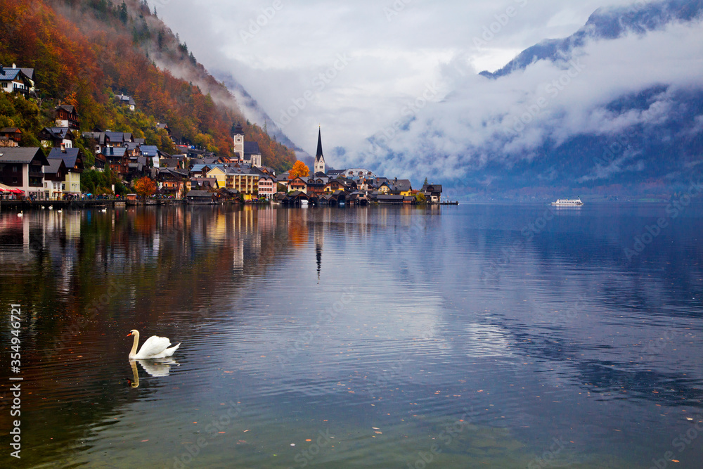 Fototapeta premium Hallstatt town view in a foggy day and clouds between the mountains, Austria.