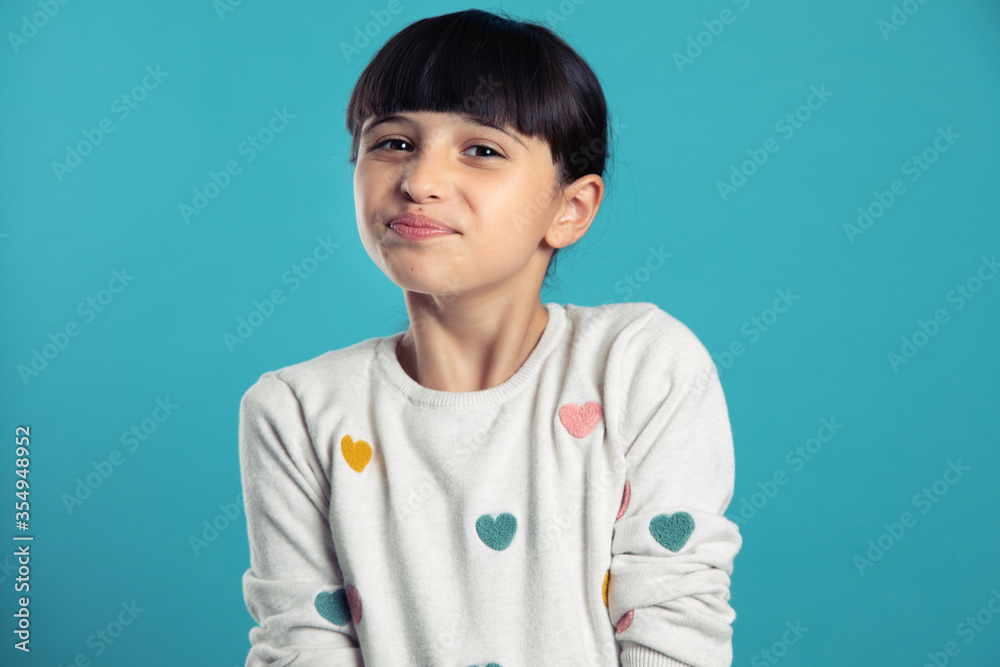 portrait of a girl with a funny head on a blue background portrait of a girl with a funny head on a blue background