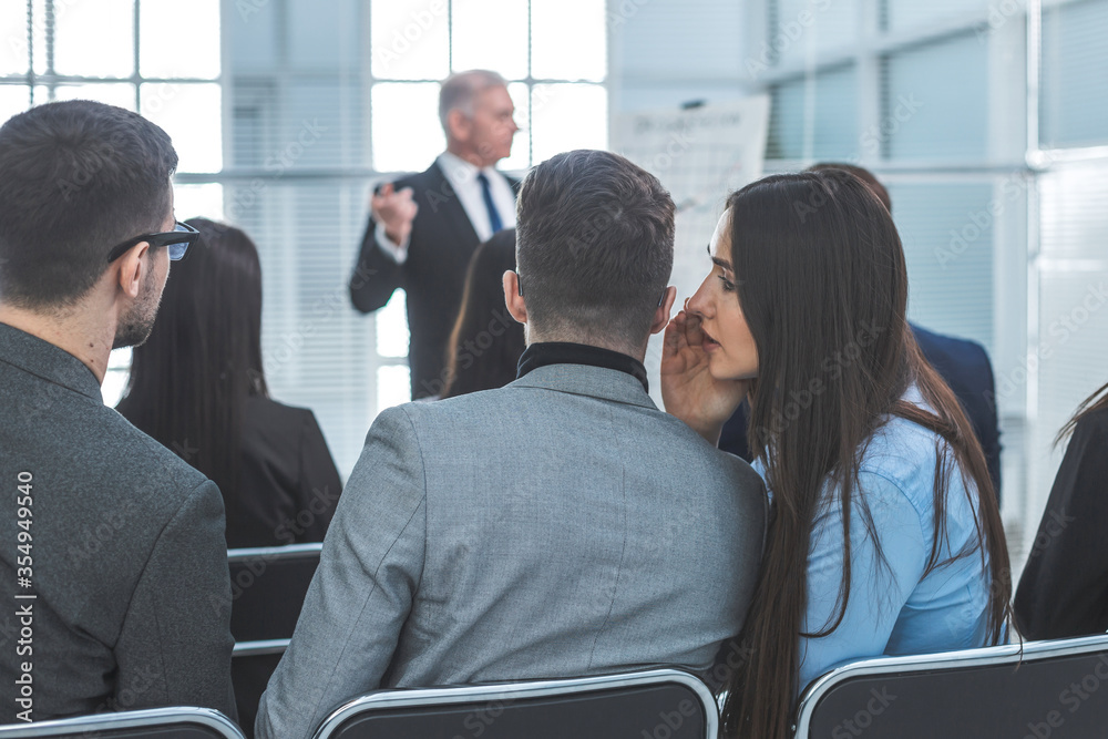 employees discuss something during a business seminar employees discuss something during a business seminar