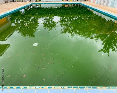 Swimming pool lacking maintenance and causing waste water photo