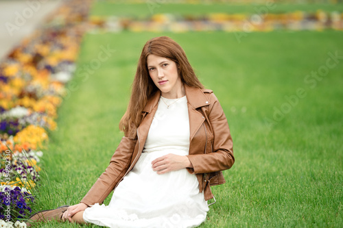 Charming pregnant woman relaxing in the park © lialia699