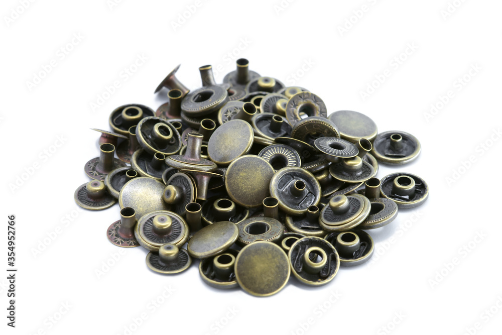 Close-up of button brass, Golden metallic, Accessory for leather work, Vintage style, Isolated on white background. Close-up of button brass, Golden metallic, Accessory for leather work, Vintage style, Isolated on white background.