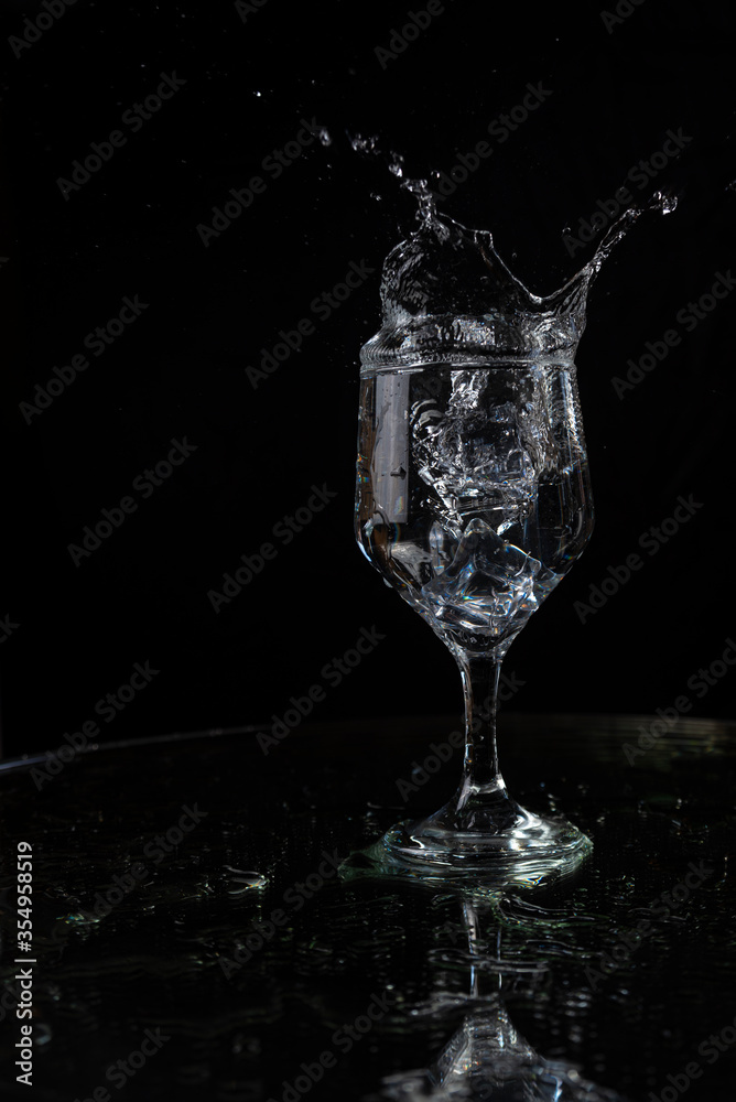 A splash with water and ice on a black background