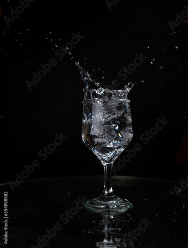 A splash with water and ice on a black background