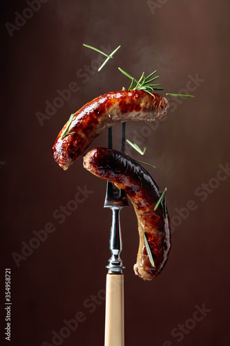 Grilled Bavarian sausages with rosemary.