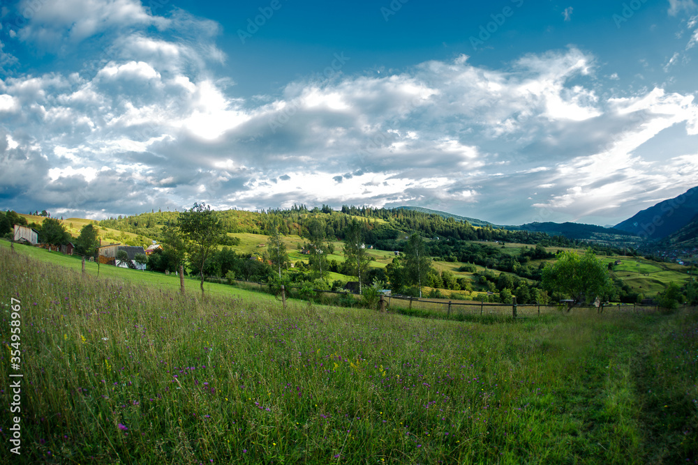 Fototapeta premium Sunset in the Carpathians. The Carpathians are a beautiful country of mountains. Carpathians are located in Ukraine. In the Carpathians, beautiful nature and many good people.