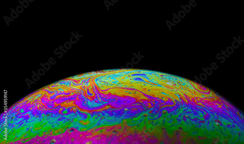 Bubble background collection shoot from liquid soap wash and water. The reflection surface are transparent, glossy, fantasy rainbow color sphere. This shot take in macro closeup abstract style. 