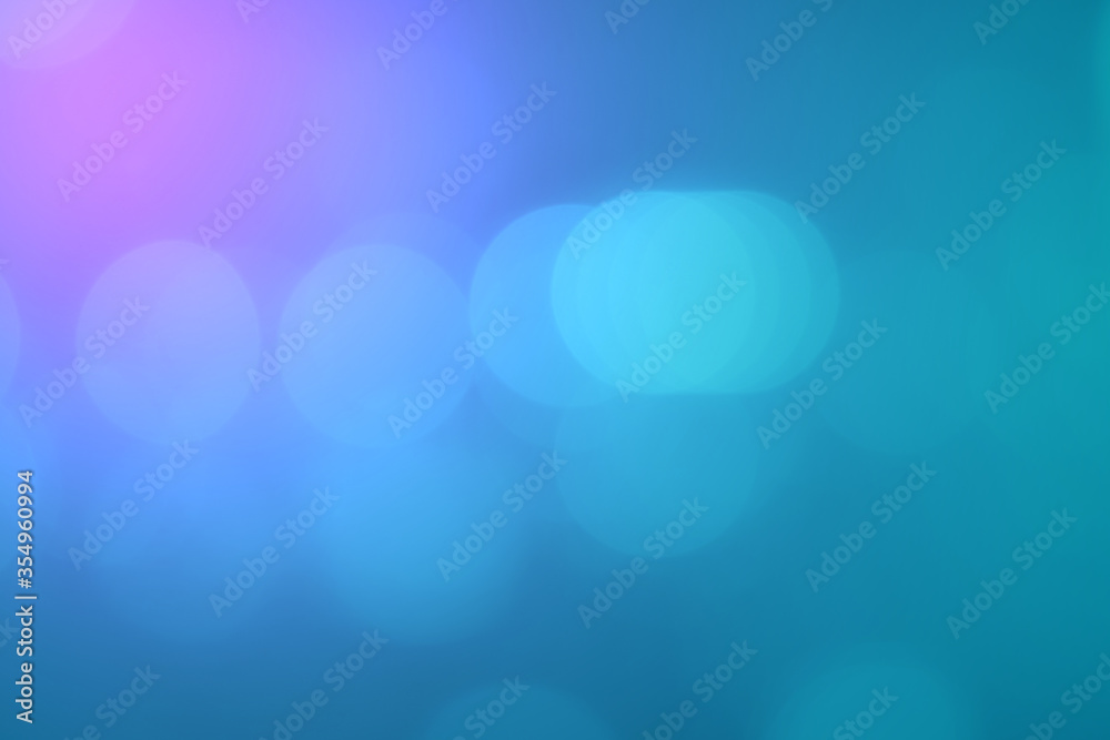 Abstract blurred bokeh on blue gradient background. Abstract blurred bokeh on blue gradient background.