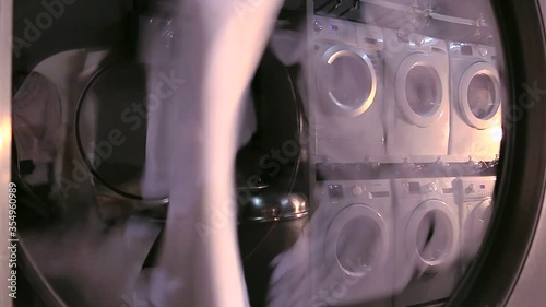 Washing clothes in the large industrial washing machines