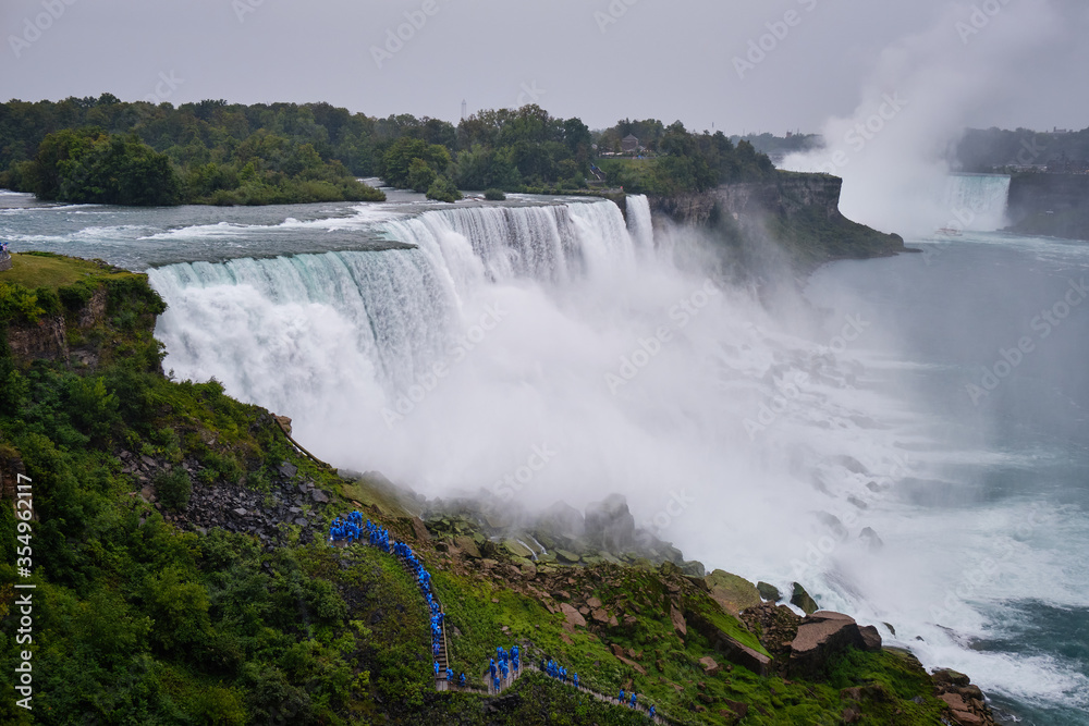 Tourists watching the rapids of the Niagara falls Tourists watching the rapids of the Niagara falls