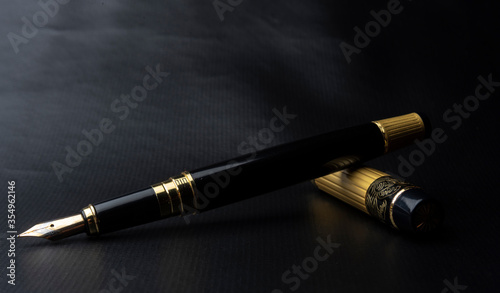 Beautiful fountain pen. under exposed photo on a black background