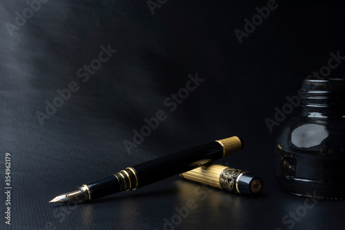 Beautiful fountain pen. under exposed photo on a black background