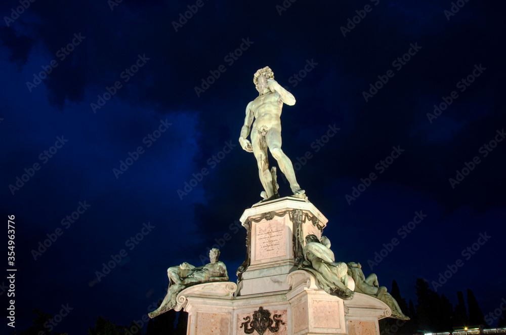 The replica of Michelangelo's David statue in Michelangelo Square at night in Florence, Italy