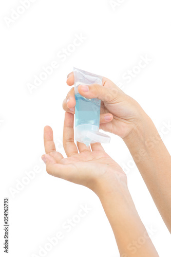 Lady using alcohol gel to clean her hand to prevent the spread of bacteria and virus with isolated background. Personal hygiene concept.