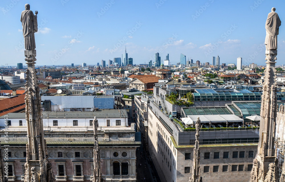 Panoramic view of Milan on business district of Porto Nuovo with modern skyscrapers from roof of famous gothic cathedral Duomo, Milan, Italy Panoramic view of Milan on business district of Porto Nuovo with modern skyscrapers from roof of famous gothic cathedral Duomo, Milan, Italy