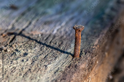 Rusty nail on old wood