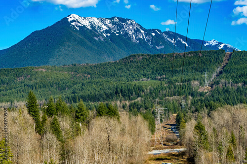 Electric lines Snow Capped Mountains Snoqualme Valley Trail North Bend Washington photo