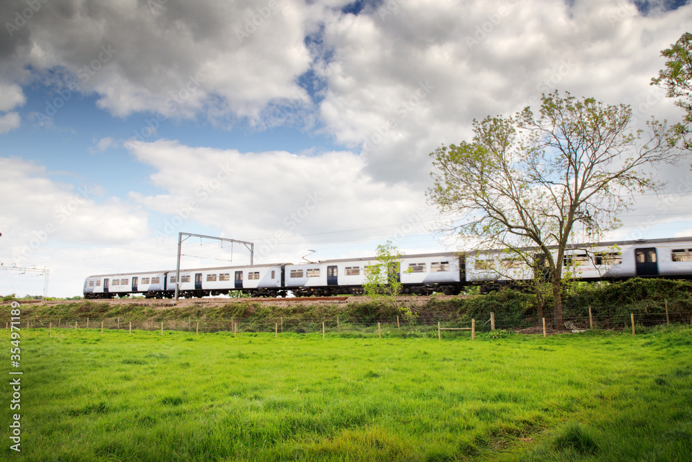 train zooming by in a  landscape image