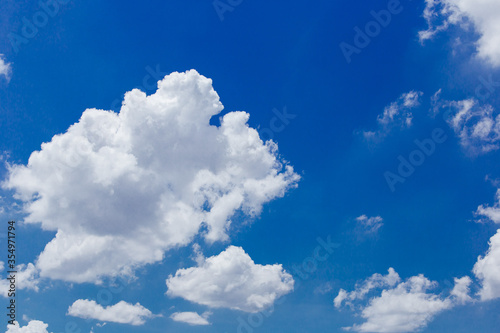 The sky is bright, full of white clouds.