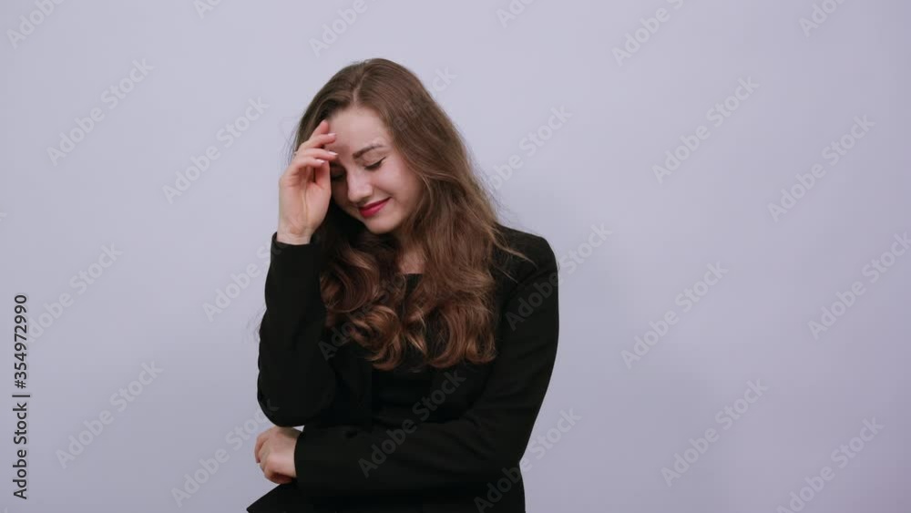 Young Attractive Woman Brunette In In A Black T-Shirt, Sweater On White Background, Cute Female Touches Her Hair And Body. People's Tenderness, Kindness Young Attractive Woman Brunette In In A Black T-Shirt, Sweater On White Background, Cute Female Touches Her Hair And Body. People's Tenderness, Kindness