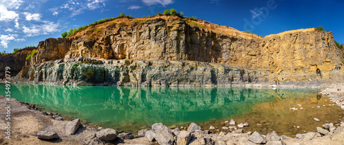 Canvas Print Abandoned granite and sand quarry with a lake