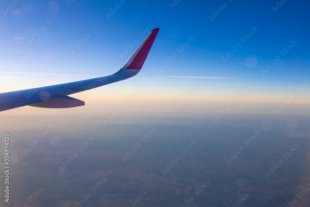 Ground and horizon at sunset from an airplane Ground and horizon at sunset from an airplane