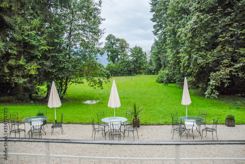 Canvas Print Beautiful greenery and lawn furniture in backyard of the von Trapp home in Salzburg, Austria