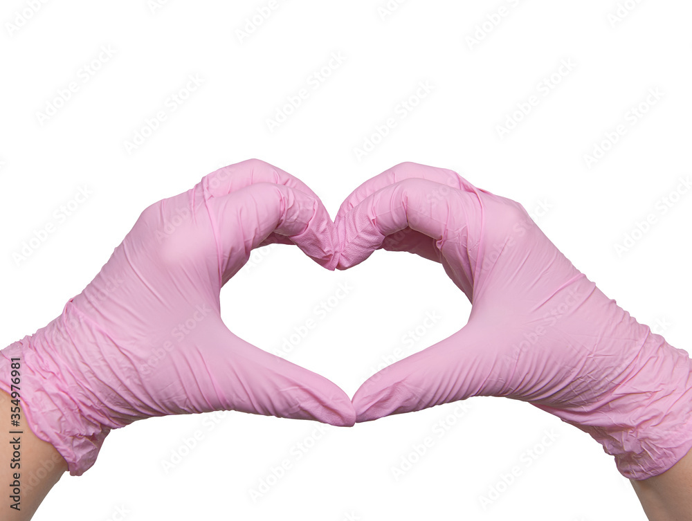 Fototapeta premium Hands in pink heart-shaped medical gloves, with love to the doctors of the world, isolated on white, copy space
