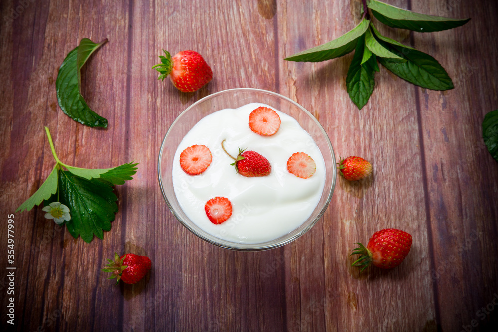 sweet homemade yogurt with red ripe fresh strawberries sweet homemade yogurt with red ripe fresh strawberries