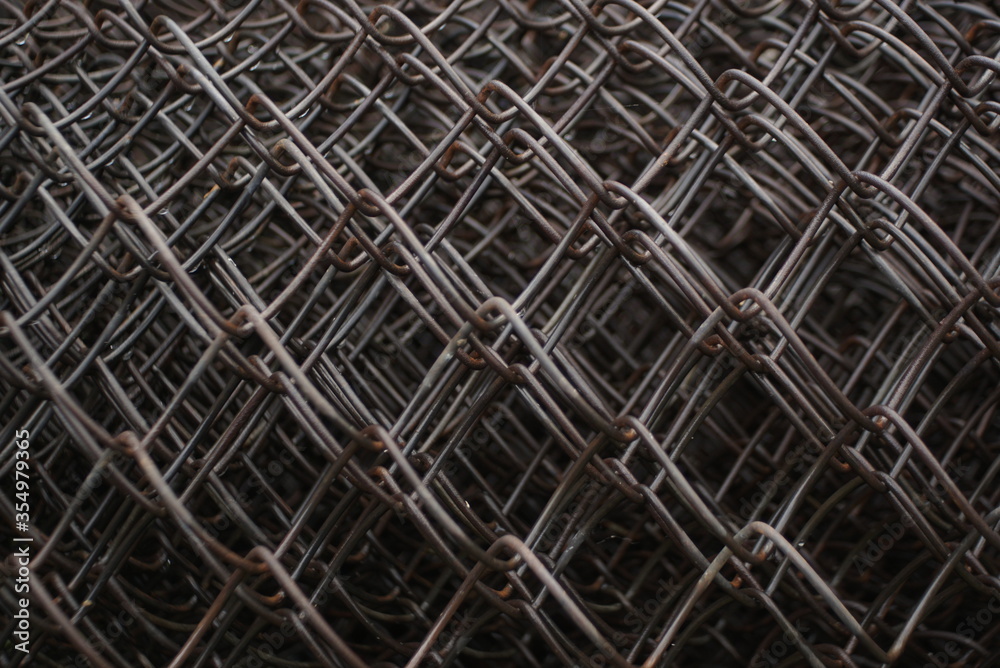 metal mesh, wet metal mesh in a roll, background