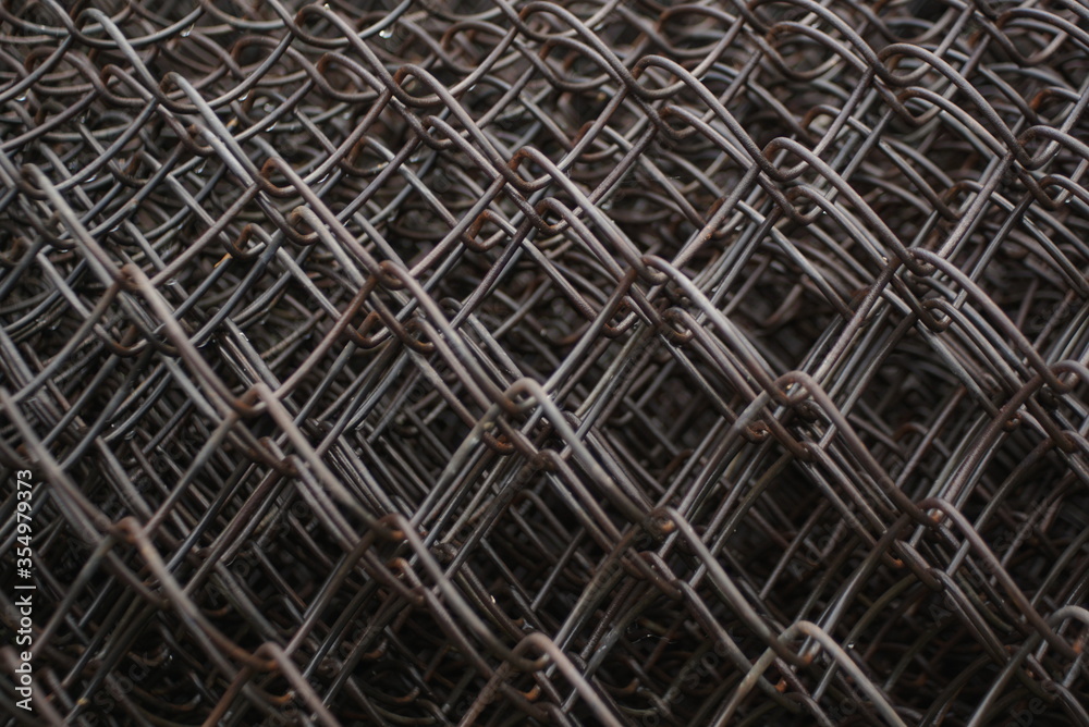 metal mesh, wet metal mesh in a roll, background