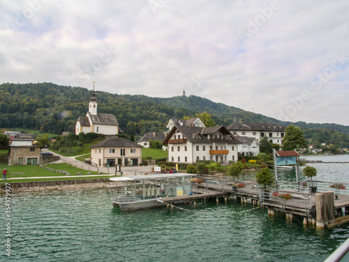 Hotels and other buildings lining the shore of beautiful blue Wörthersee in Austria