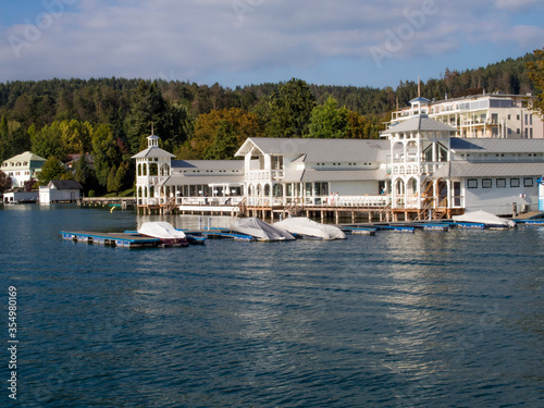 Hotels and other buildings lining the shore of beautiful blue Wörthersee in Austria