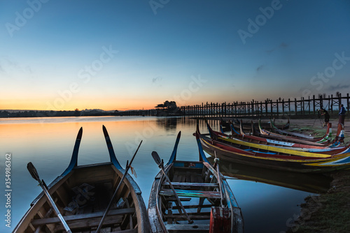 Wallpaper Mural Wooden boat in Ubein Bridge at sunrise, Mandalay, Myanmar (World longest wooden bridge) Torontodigital.ca