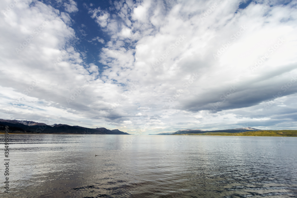 Archipelago of small islands in the Beagle Channel near Ushuaia (Argentina) with mountains in the background