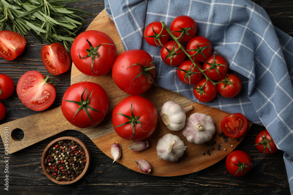 Composition with tomatoes on wooden background. Ripe vegetable Composition with tomatoes on wooden background. Ripe vegetable