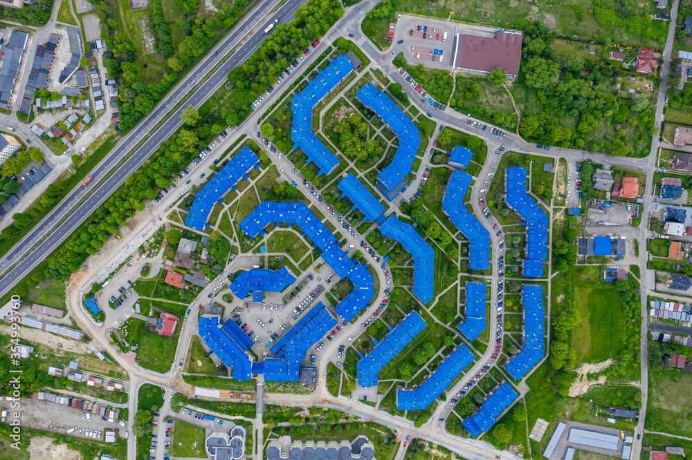 Obraz premium Aerial view of the housing estate with blue roofs. Estate Sloviki located on Witosa street is also called 