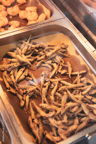 small fried fish in the market stall