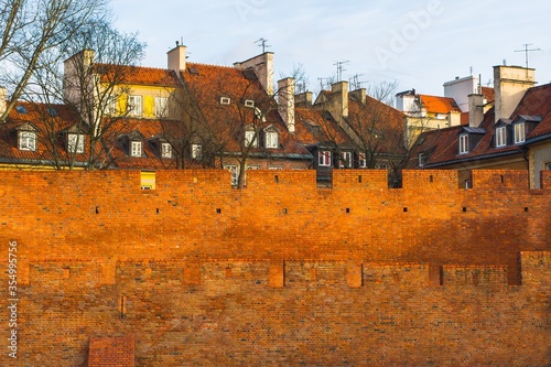 Old Town buildings behind a brick wall  - Warsaw © Adam