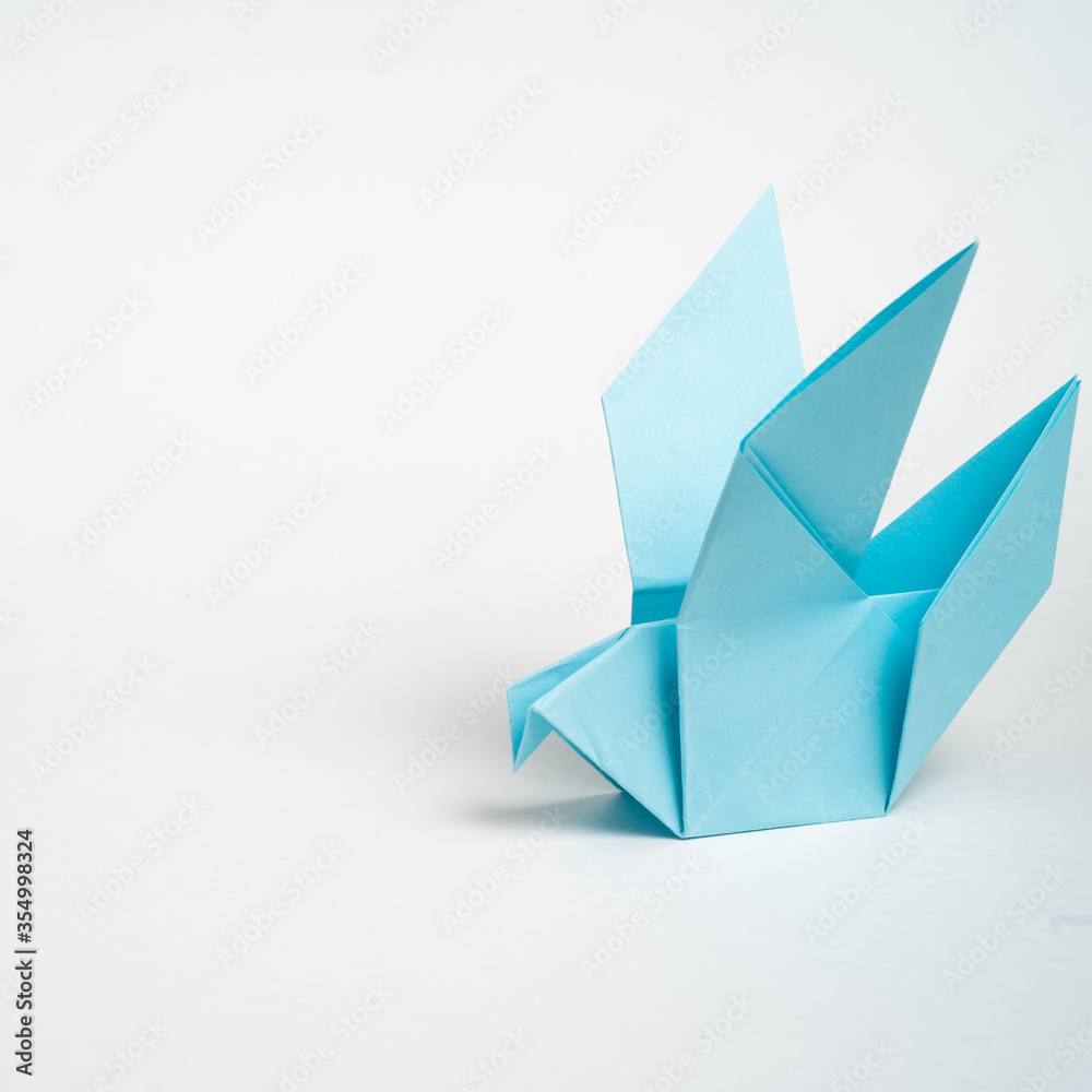origami blue dove on a white background origami blue dove on a white background