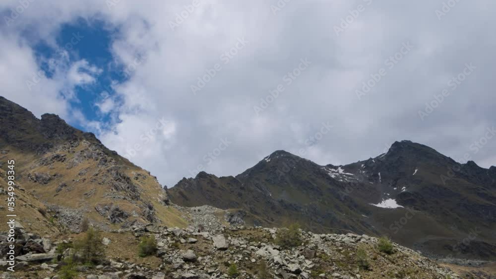 Time lapse of Alpine peaks with moving clouds. Italian Alps 4K Time lapse of Alpine peaks with moving clouds. Italian Alps 4K